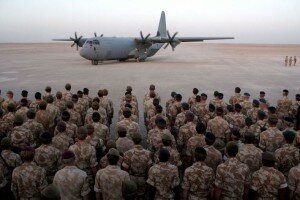 Coalition troops waiting to board C 130