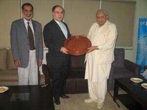 Senator Prof Khurshid presnting a shield to Shakri