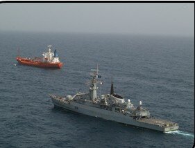 Pakistan Navy ship escorting the pirated ship